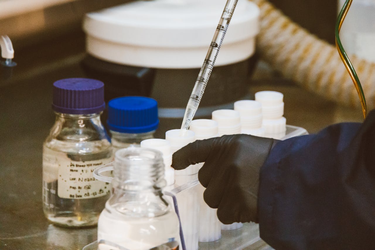 Detailed view of laboratory equipment and pipette in use, enhancing scientific research.